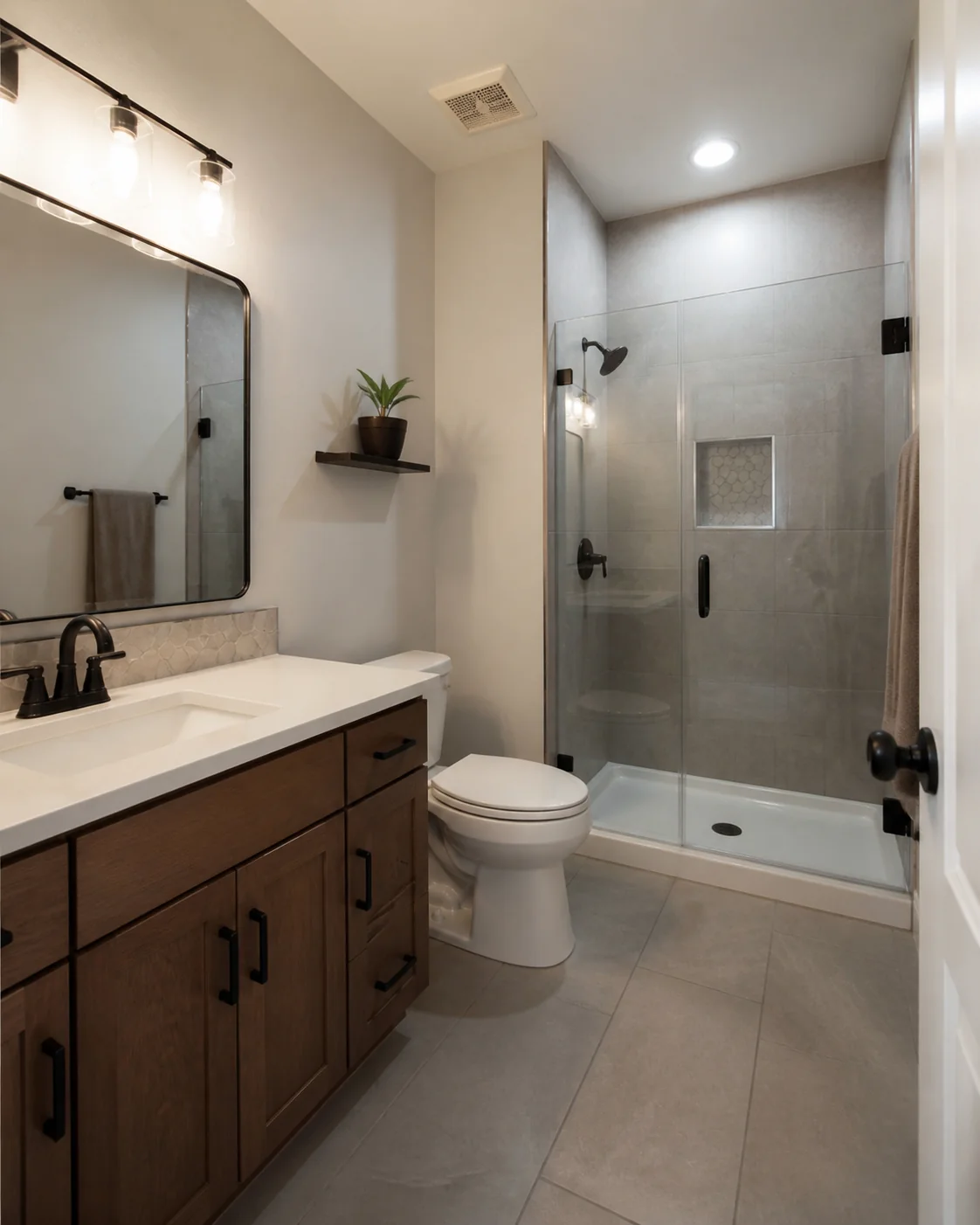 Finished bathroom layout with vanity, toilet, and shower circulation