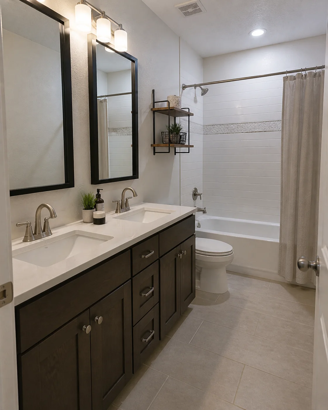 Finished bathroom vanity, toilet, tub, and plumbing fixtures