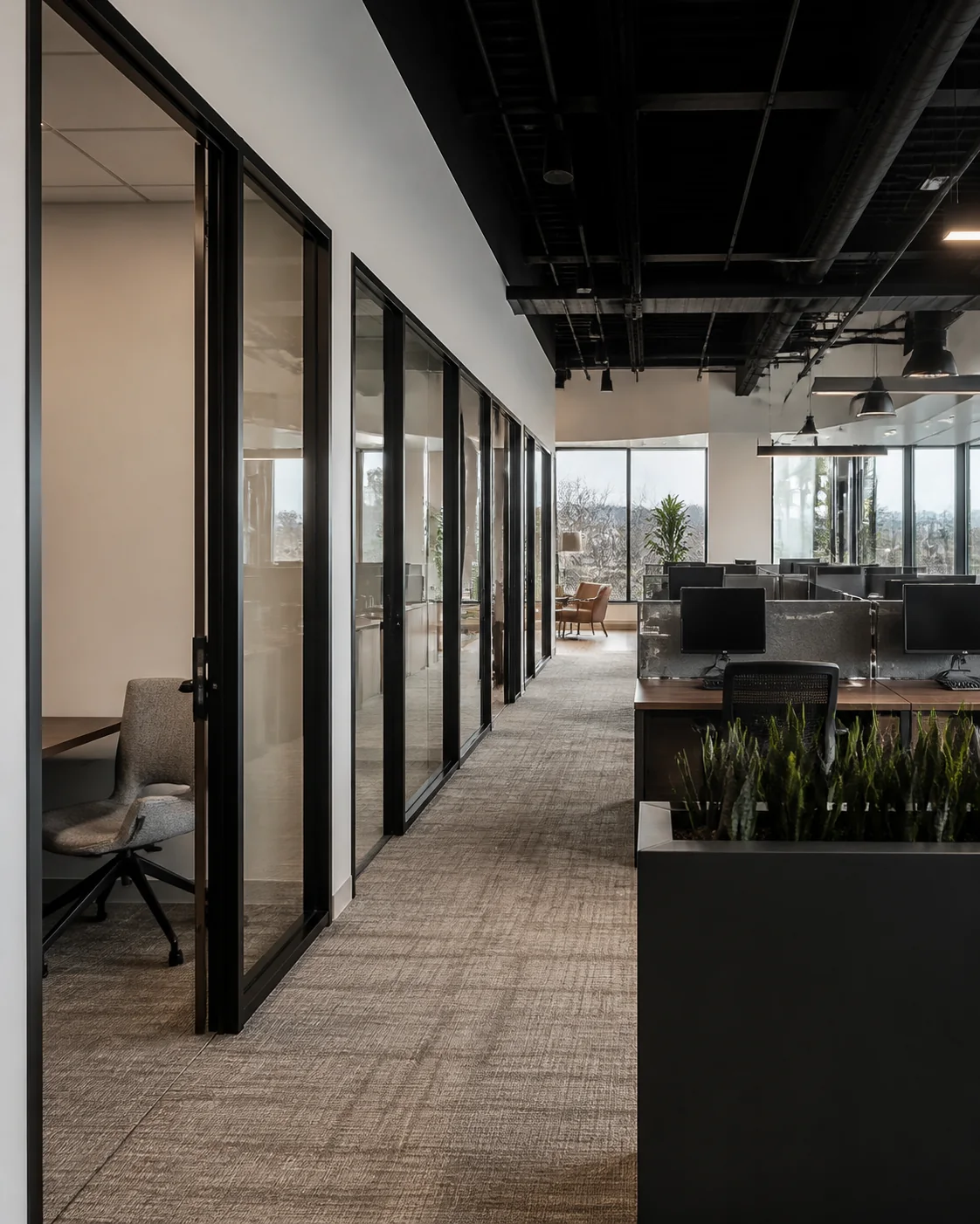 Finished office layout with glass offices and open workstations